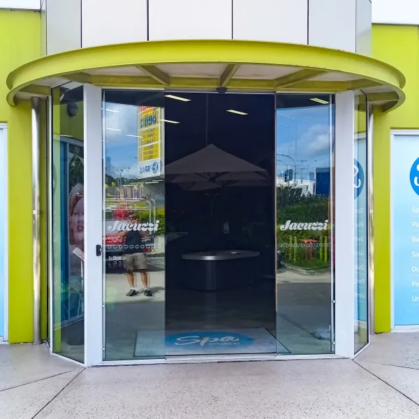 Banners and front door graphics designed and installed by Signarama Springwood for Spa World Underwood, refreshing storefront signage with modern branding