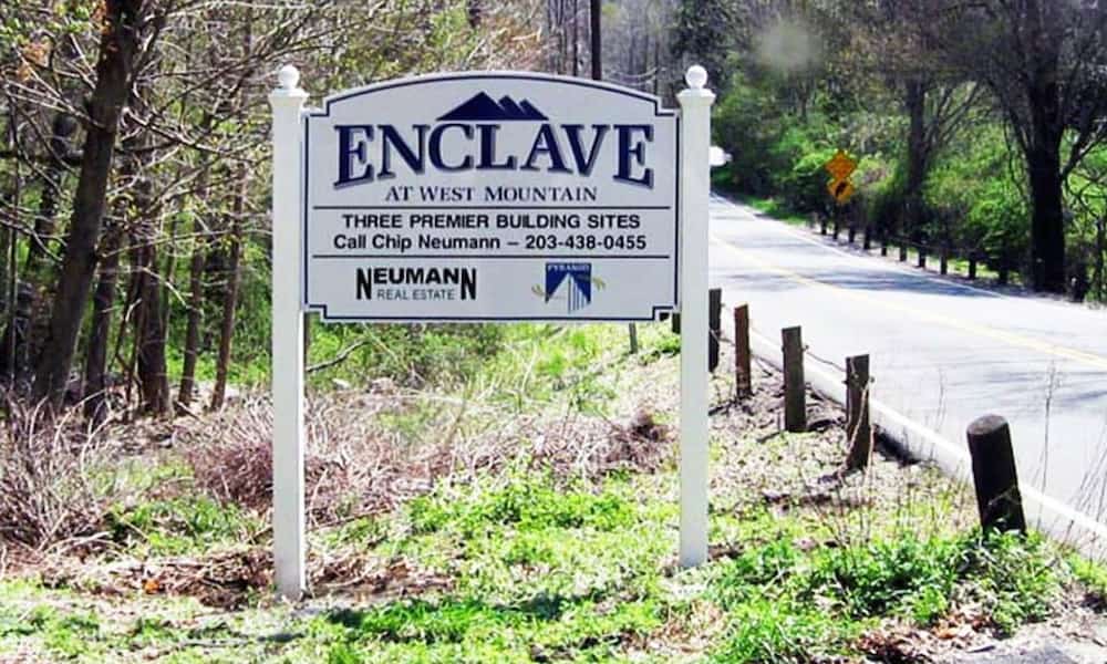 Real estate sign installed outside a residential listing