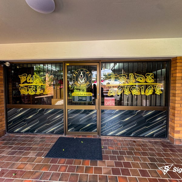 Sailtrack banner and custom window graphics created and installed by Signarama Springwood for Dog House Collectables storefront signage