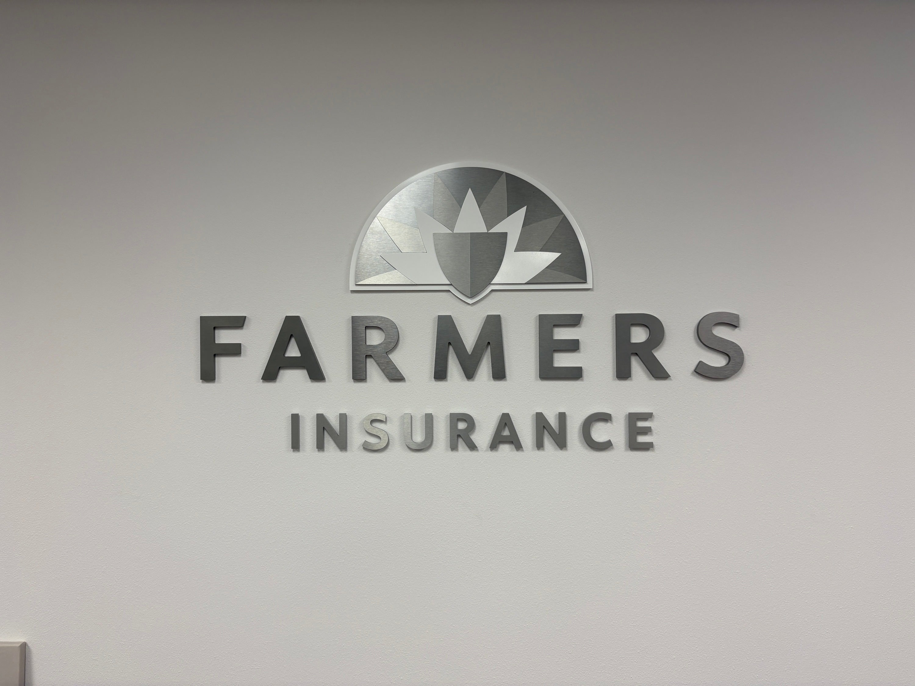 Helping a Farmers Insurance Agent Move Locations With Professional Sign Removal, Sign Installation, and a Stress-Free Relocation Process
