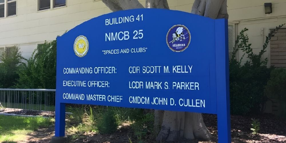 Blue informational sign for Building 41, home to the NMCB 25 Seabee unit