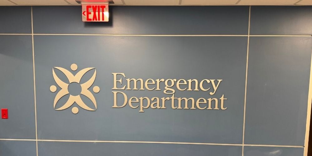 An image of a blue hospital wall featuring an 