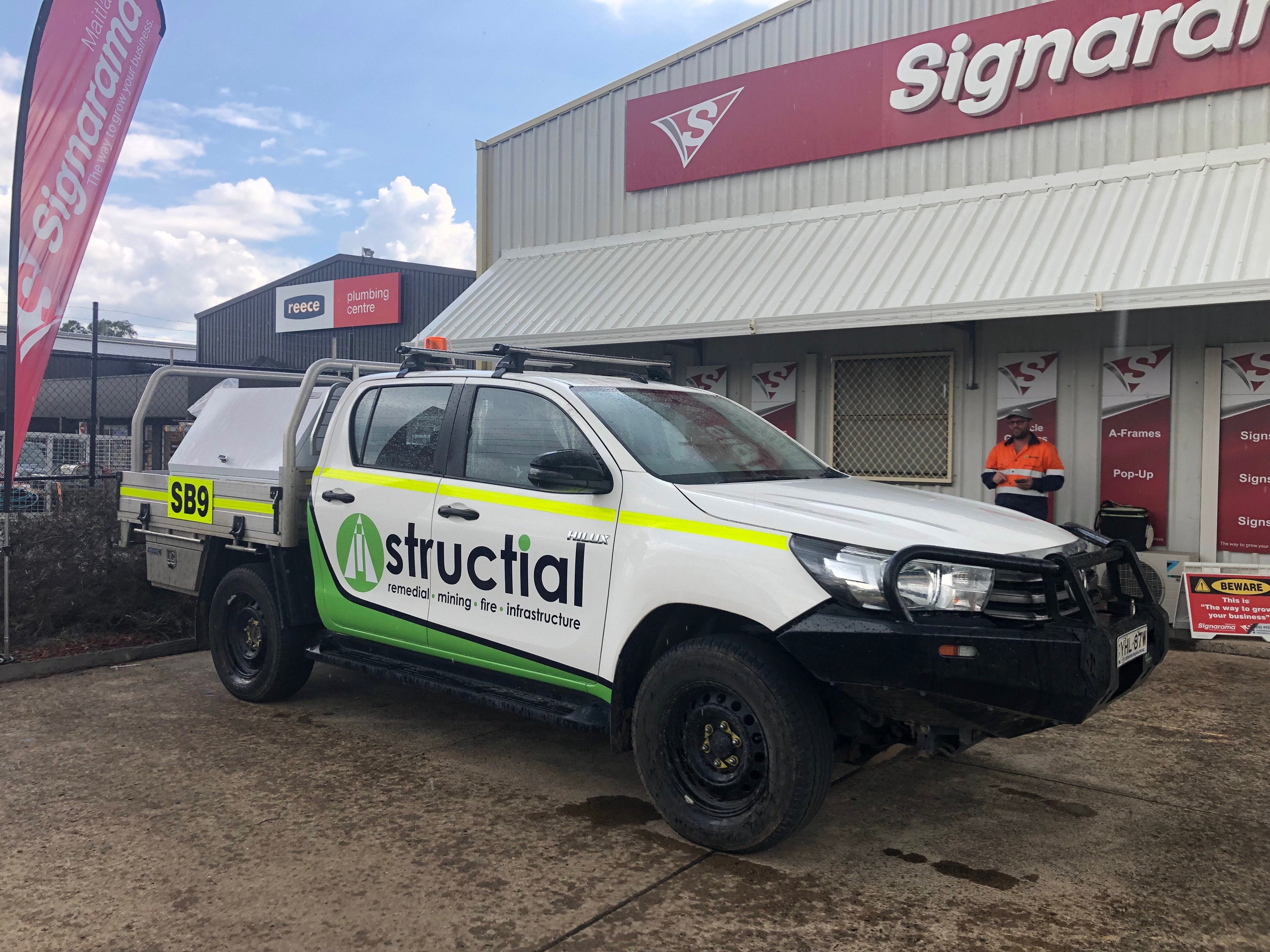 Reflective Vehicle Signage for mine spec fleet vehicle with all required reflective graphics, numbers and stripes.