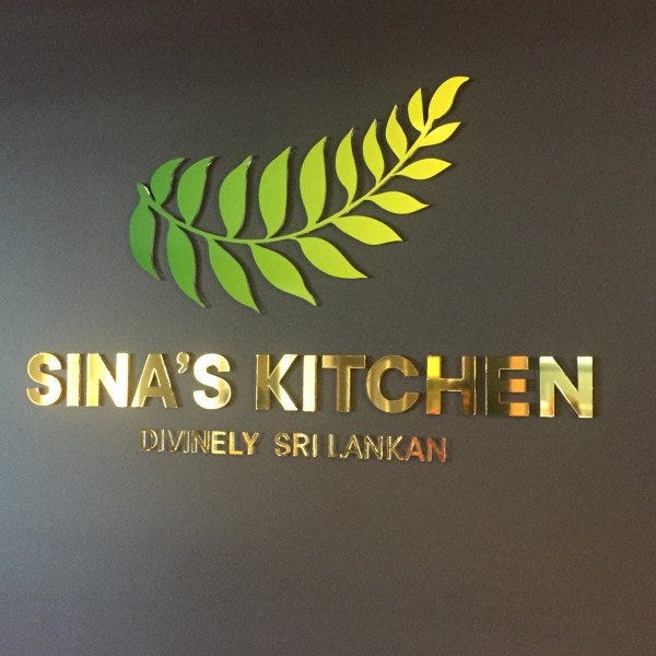 Indoor Restaurant Signage-10 mm thick acrylic having polished edges with green and gold vinyl on the face of the acrylic.