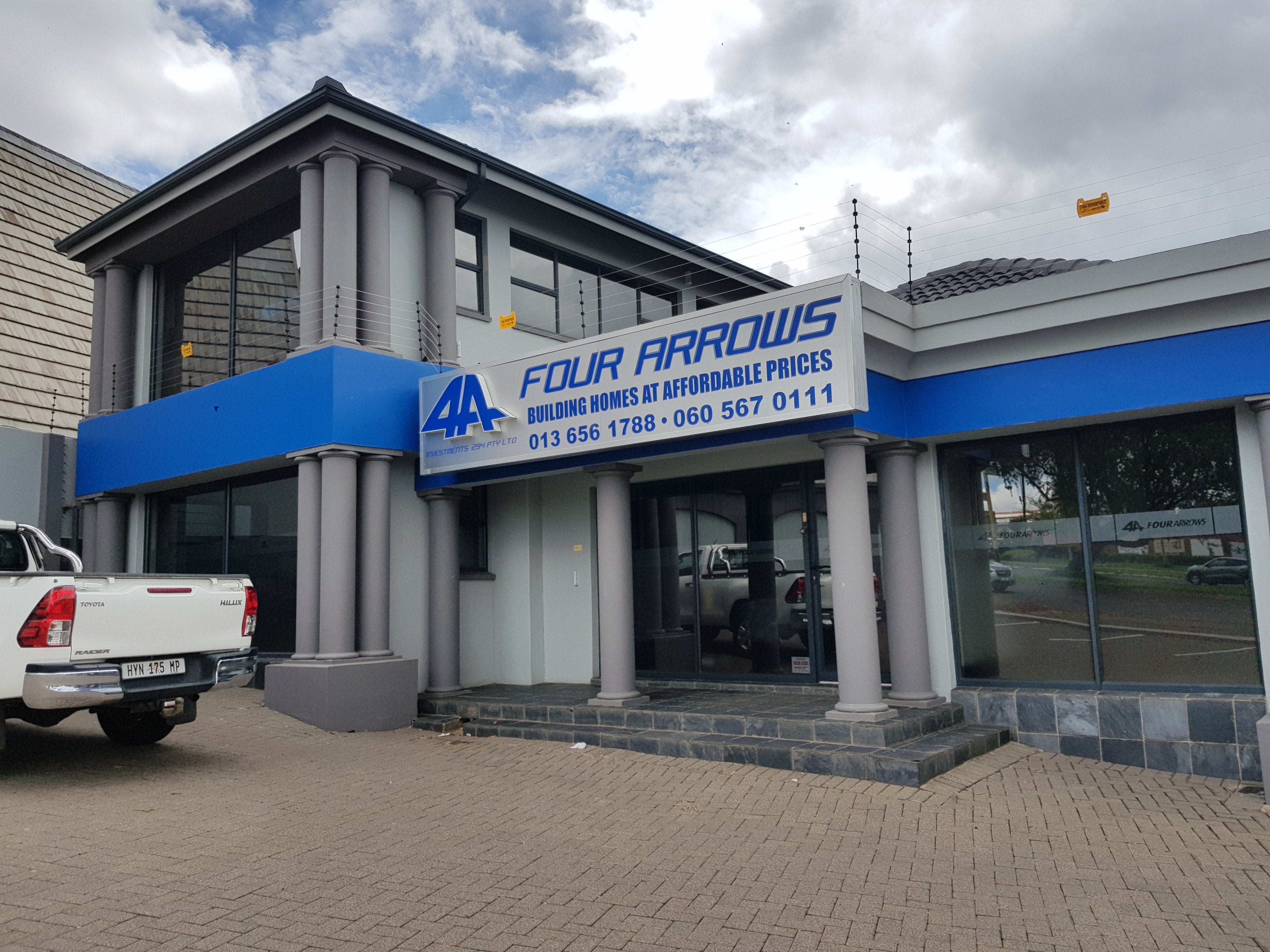 Building Signs | Four Arrows