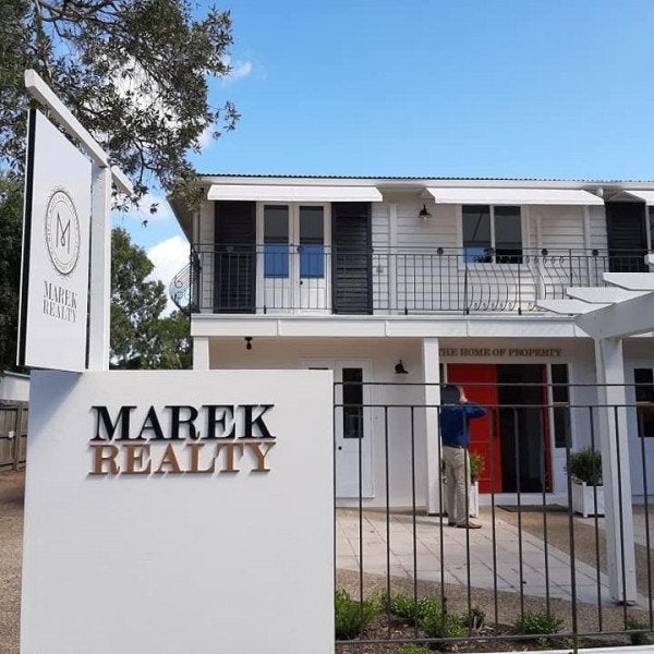 New signage for Marek Realty's new location