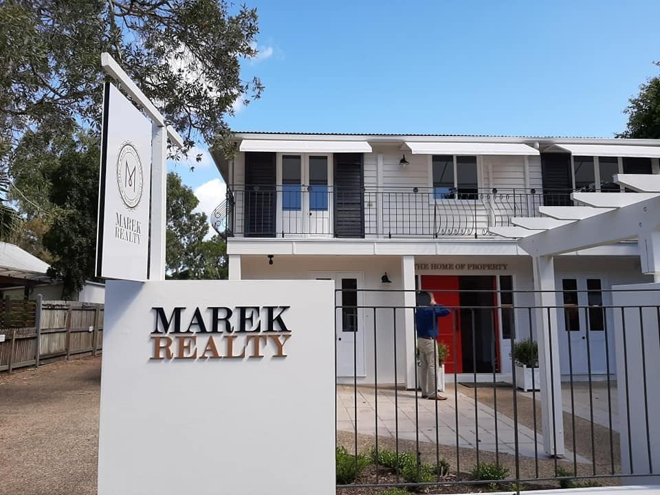New signage for Marek Realty's new location