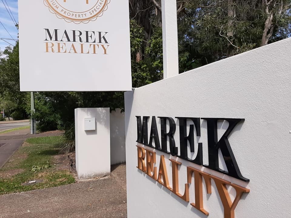 New signage for Marek Realty's new location