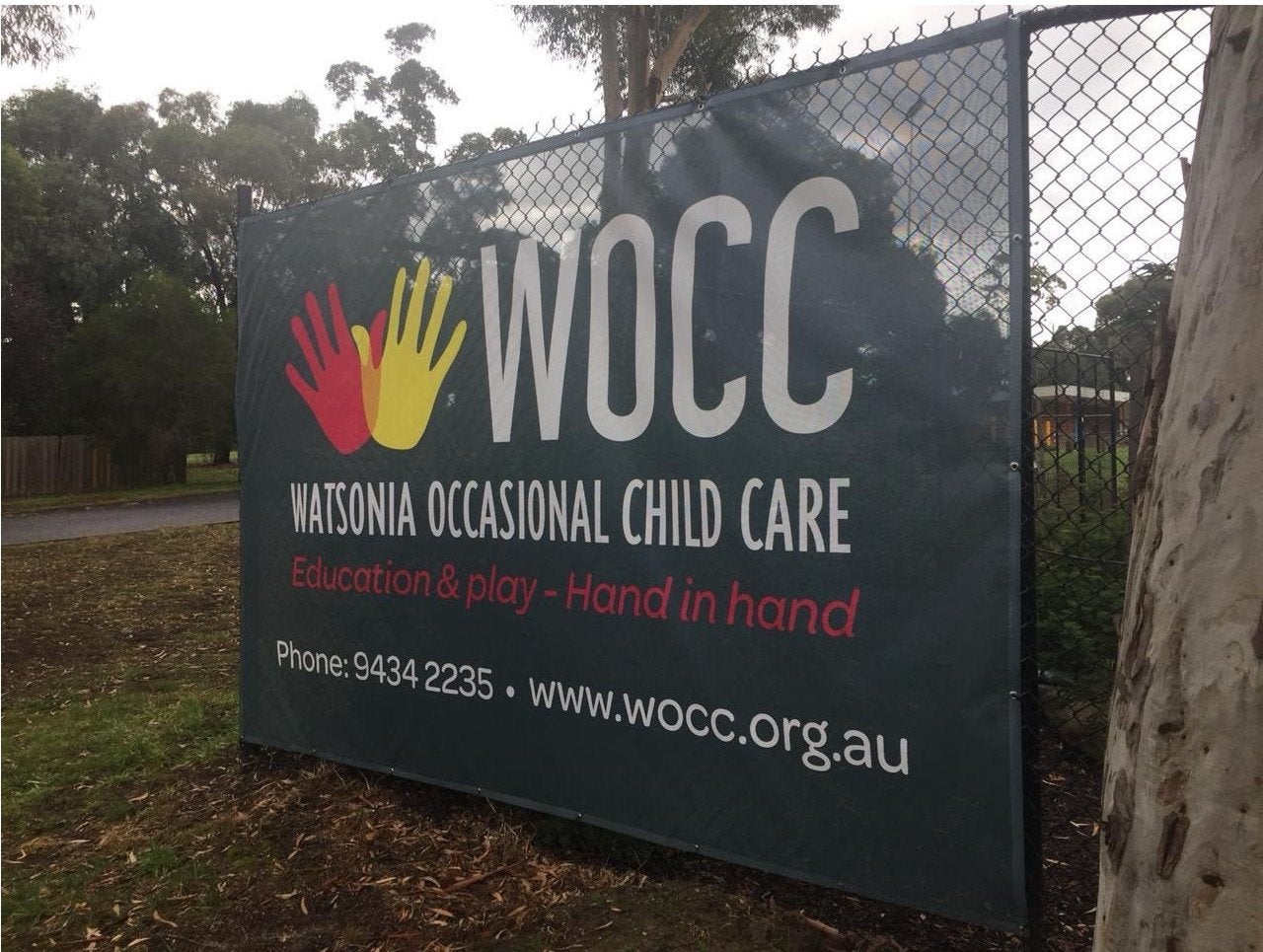 Large grey fence mesh banners for a childcare centre | Signage