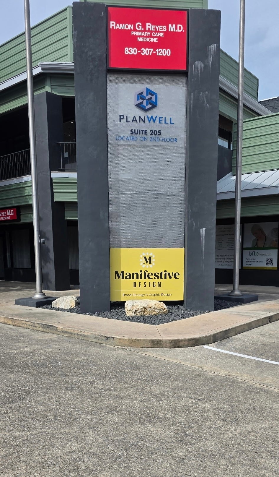 New Location, New Look: Bringing Manifestive's Brand to Life with Interior & Exterior Signage