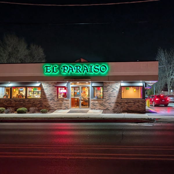 El Paraiso Green backlit sign