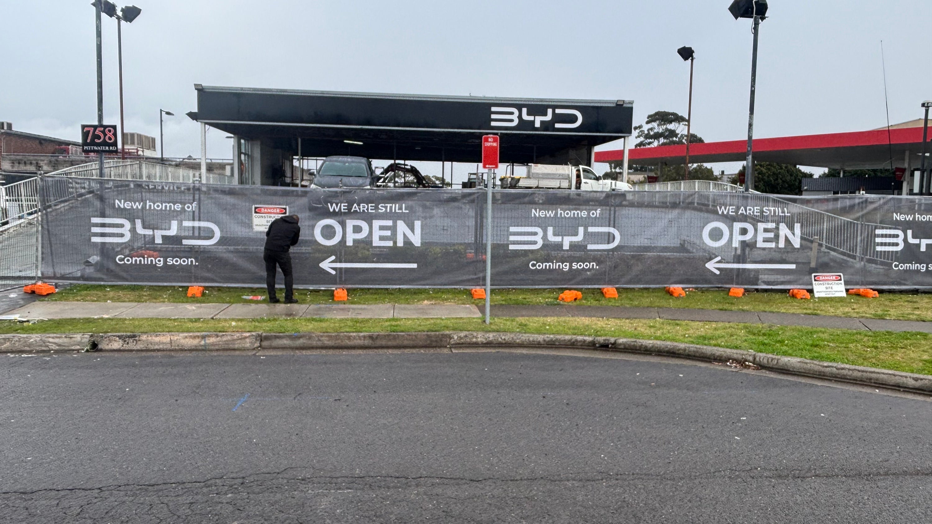 Custom Mesh Banner Installation for Construction Site Fencing