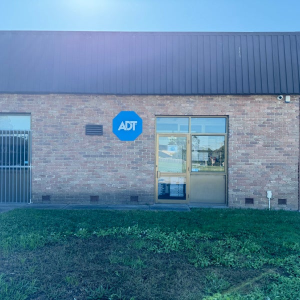 Custom aluminium composite panel sign displaying the ADT logo with a professional finish for outdoor business signage.