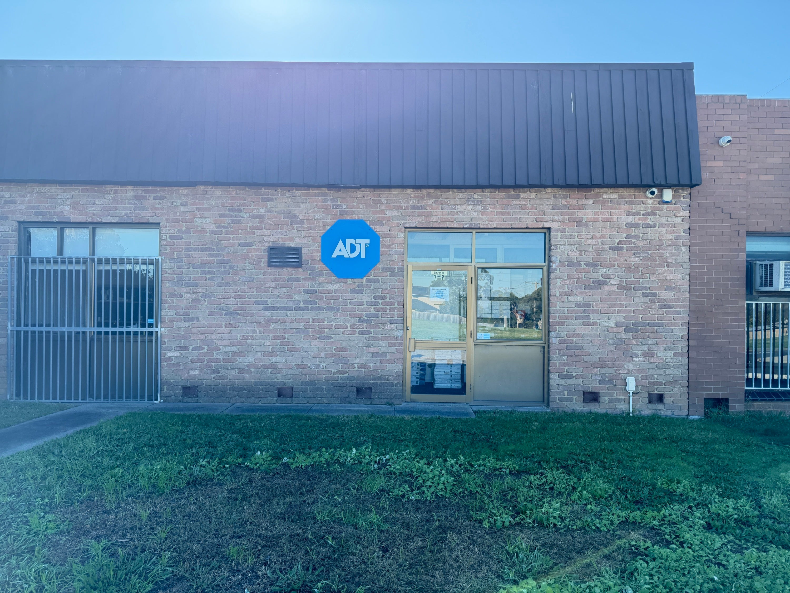 Custom aluminium composite panel sign displaying the ADT logo with a professional finish for outdoor business signage.
