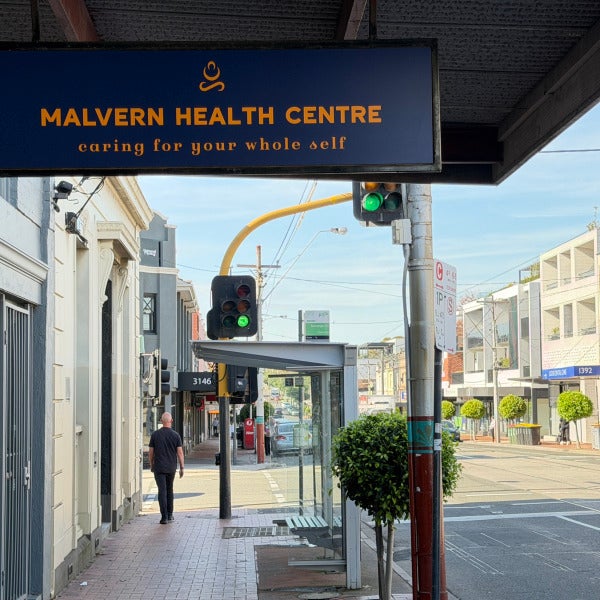 Custom aluminium composite panel sign displaying the Malvern Health Centre logo and branding for professional healthcare facility signage.