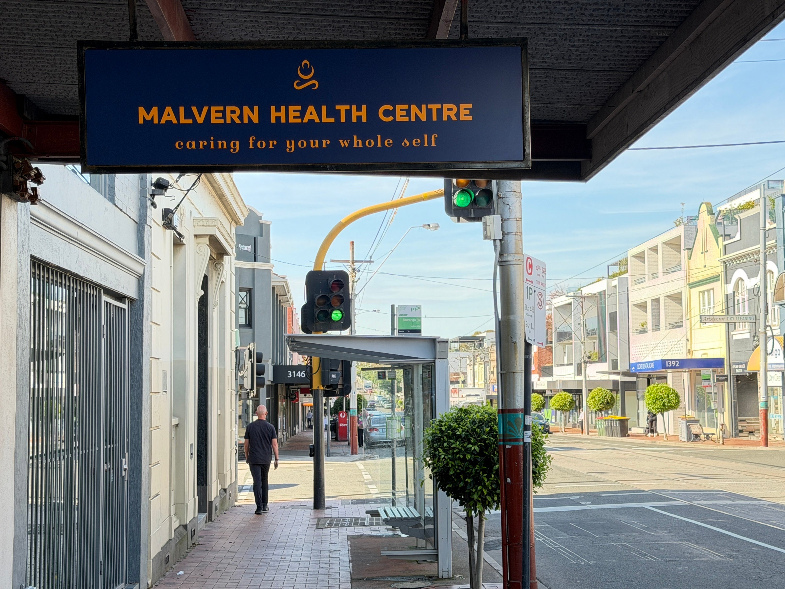 Custom aluminium composite panel sign displaying the Malvern Health Centre logo and branding for professional healthcare facility signage.