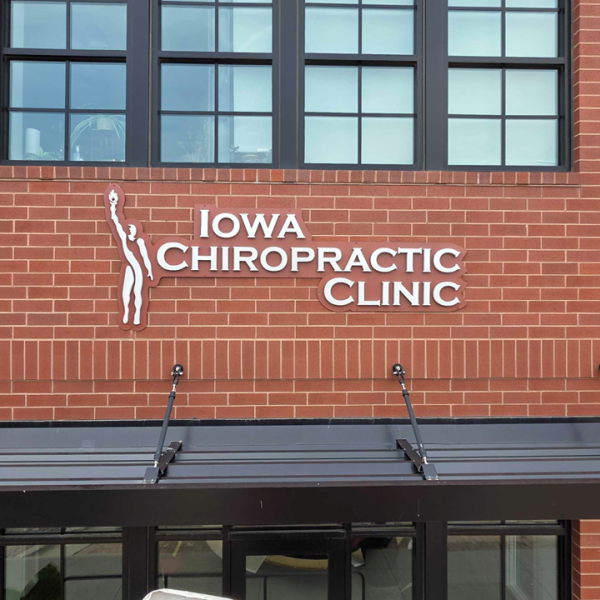 Custom Building Sign Welcomes Iowa Chiropractic Clinic to The District at Prairie Trail