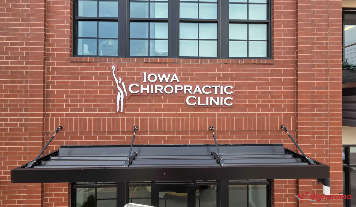 Custom Building Sign Welcomes Iowa Chiropractic Clinic to The District at Prairie Trail