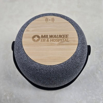 https://cdn.gorilladash.com/images/media/22156081/fully-promoted-usa-milwaukee-er-hospital-bamboo-wireless-charging-speaker-top-square-6a7de49761400.jpg?auto=webp&crop=1%3A1%2Csmart&width=400