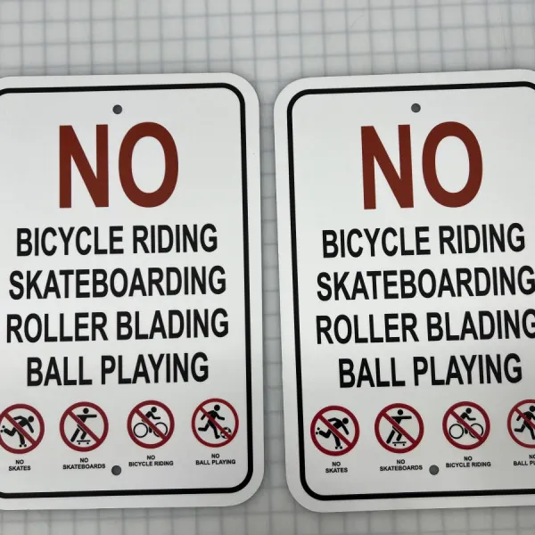 NO biking, skating, roller blading, ball playign sign
