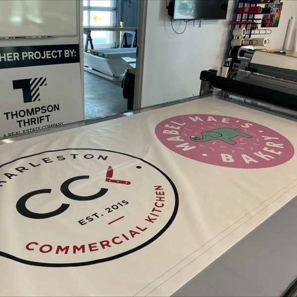 Custom Sign-4 x 8 Banner custom to accommodate two adjacent businesses