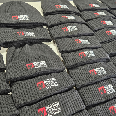 https://cdn.gorilladash.com/images/media/22376059/fully-promoted-usa-nielsen-technical-clothing-custom-embroidered-beanies-2jpg-square-6ac500b9ded86.png?auto=webp&crop=1%3A1%2Csmart&width=400