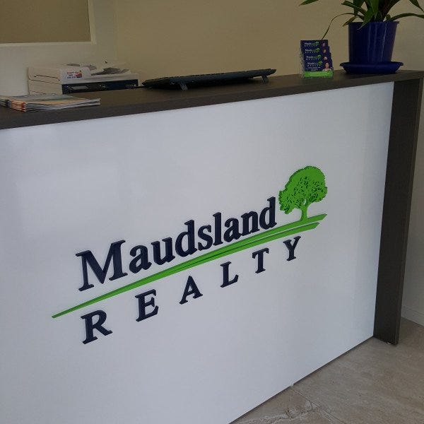 Maudsland Realty Laser cut acrylic letters direct installed to reception desk