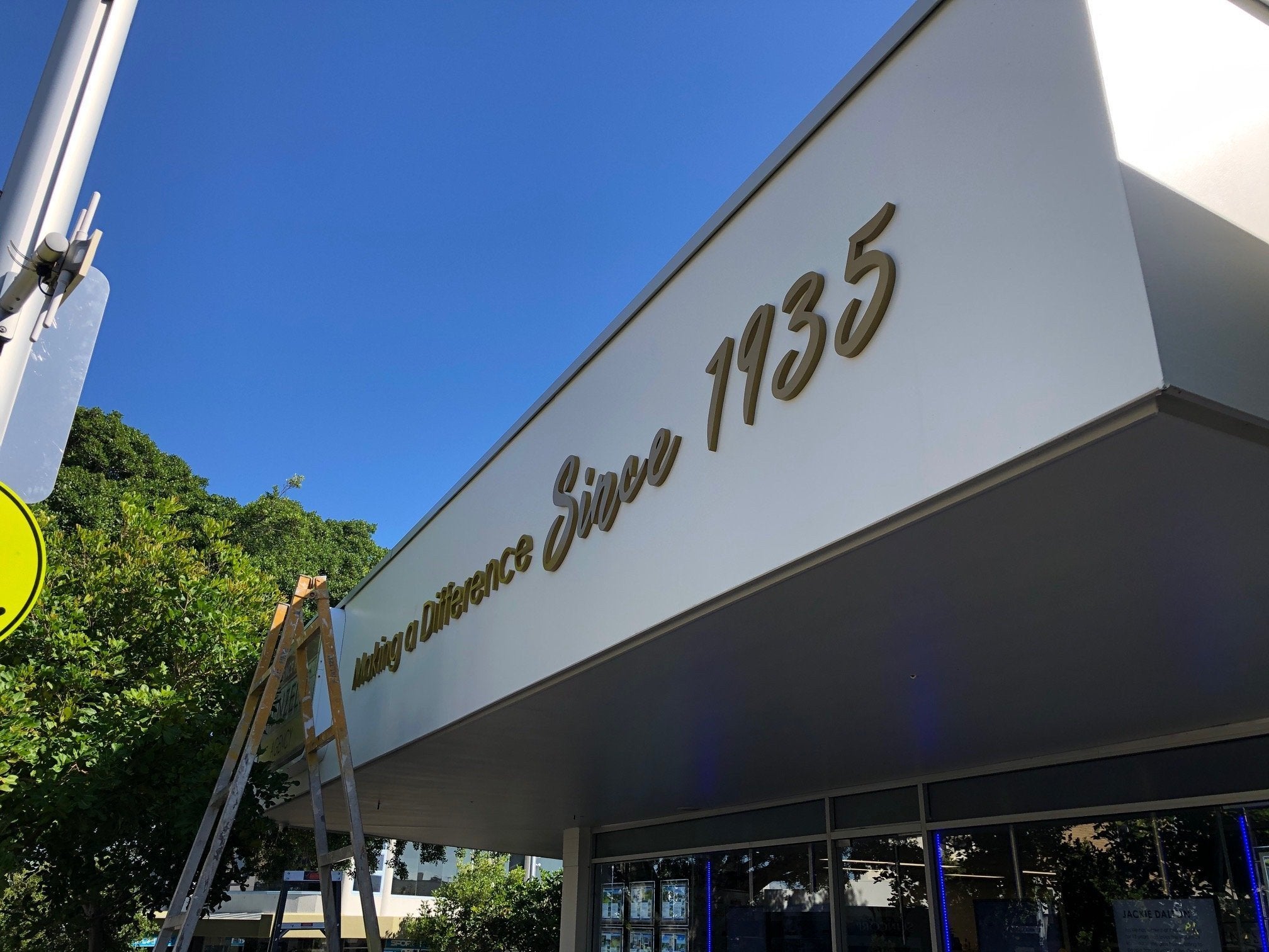 Henzells Agency Signage Installation