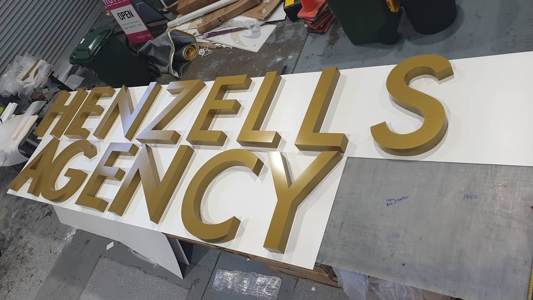 Henzells Agency Signage Installation