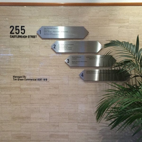 Wayfinding Metal signage made with aluminium plaques within a building reception