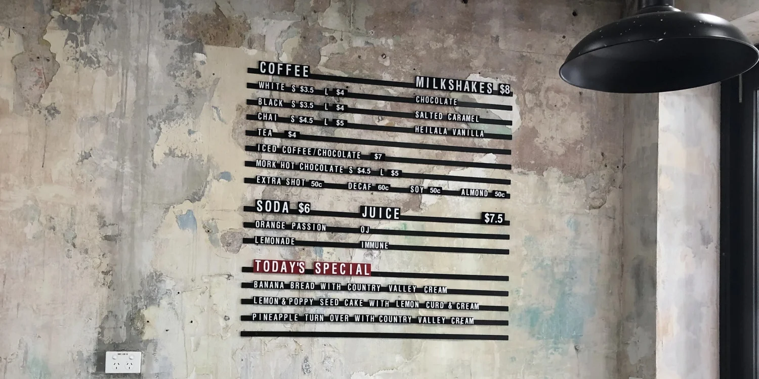 Menu lettering on a wall as a menu board | Signarama