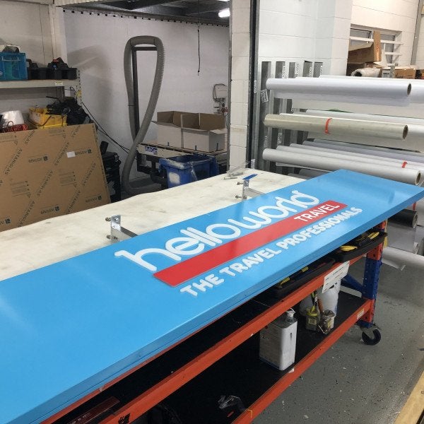 helloworld fascia with illuminated lettering and wall signage complete