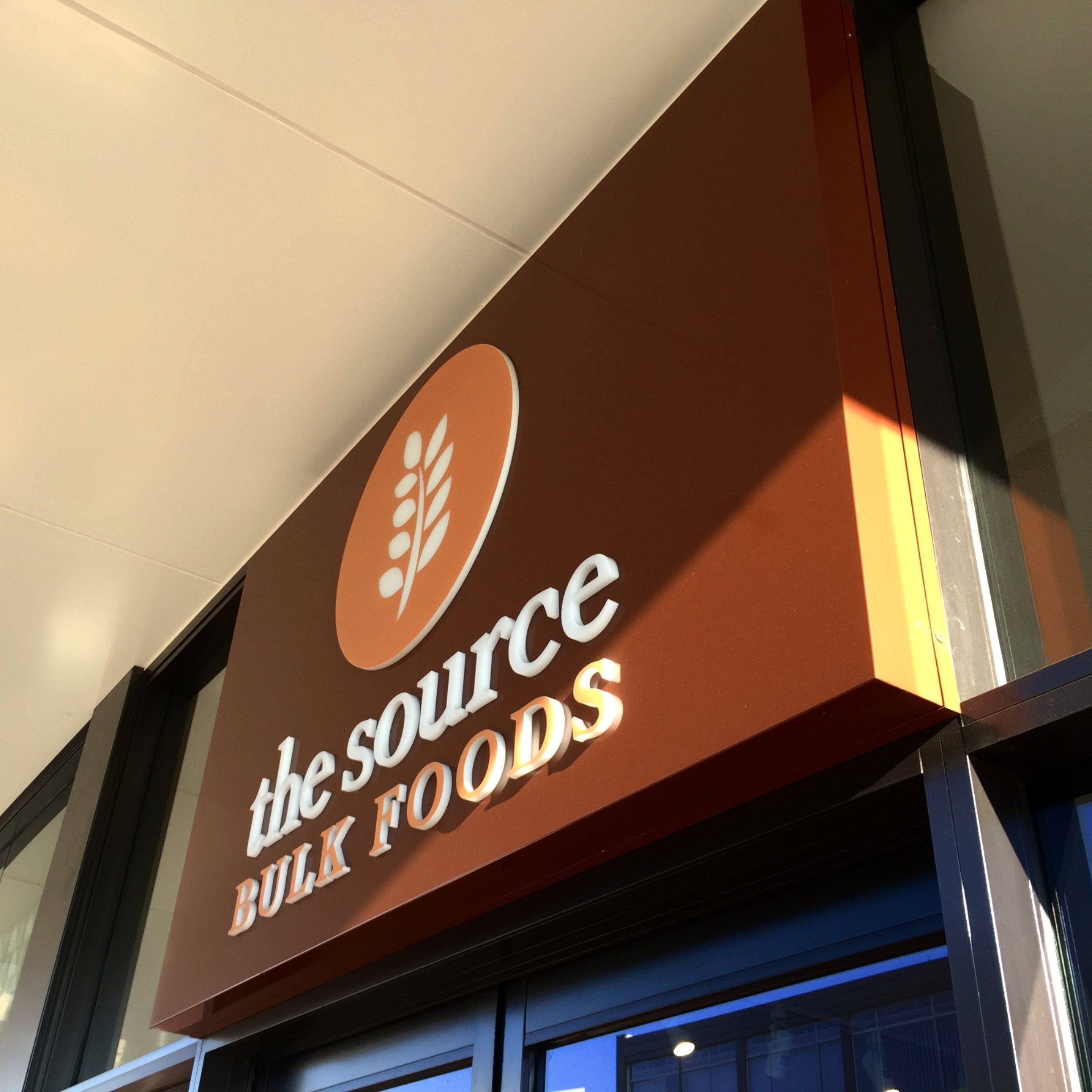 The Source Bulk Foods lightbox with vinyl and acrylic 3d letters - Signarama Sydney CBD South