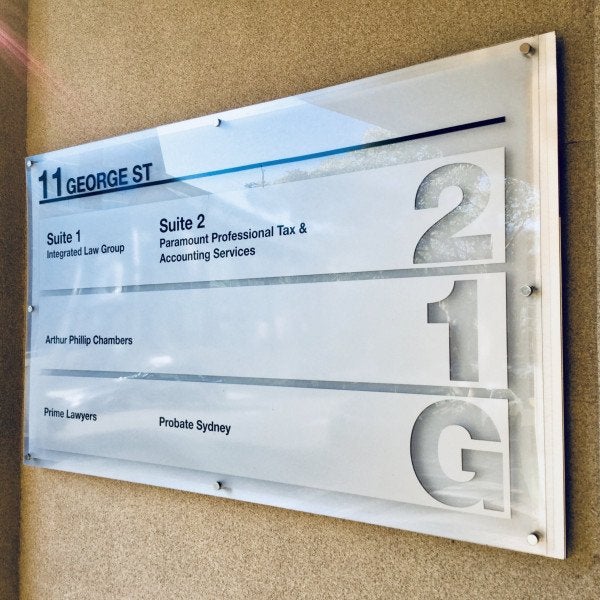 Sleek directory board for an multi level office building with office names information. Grey with black writing and transparent features
