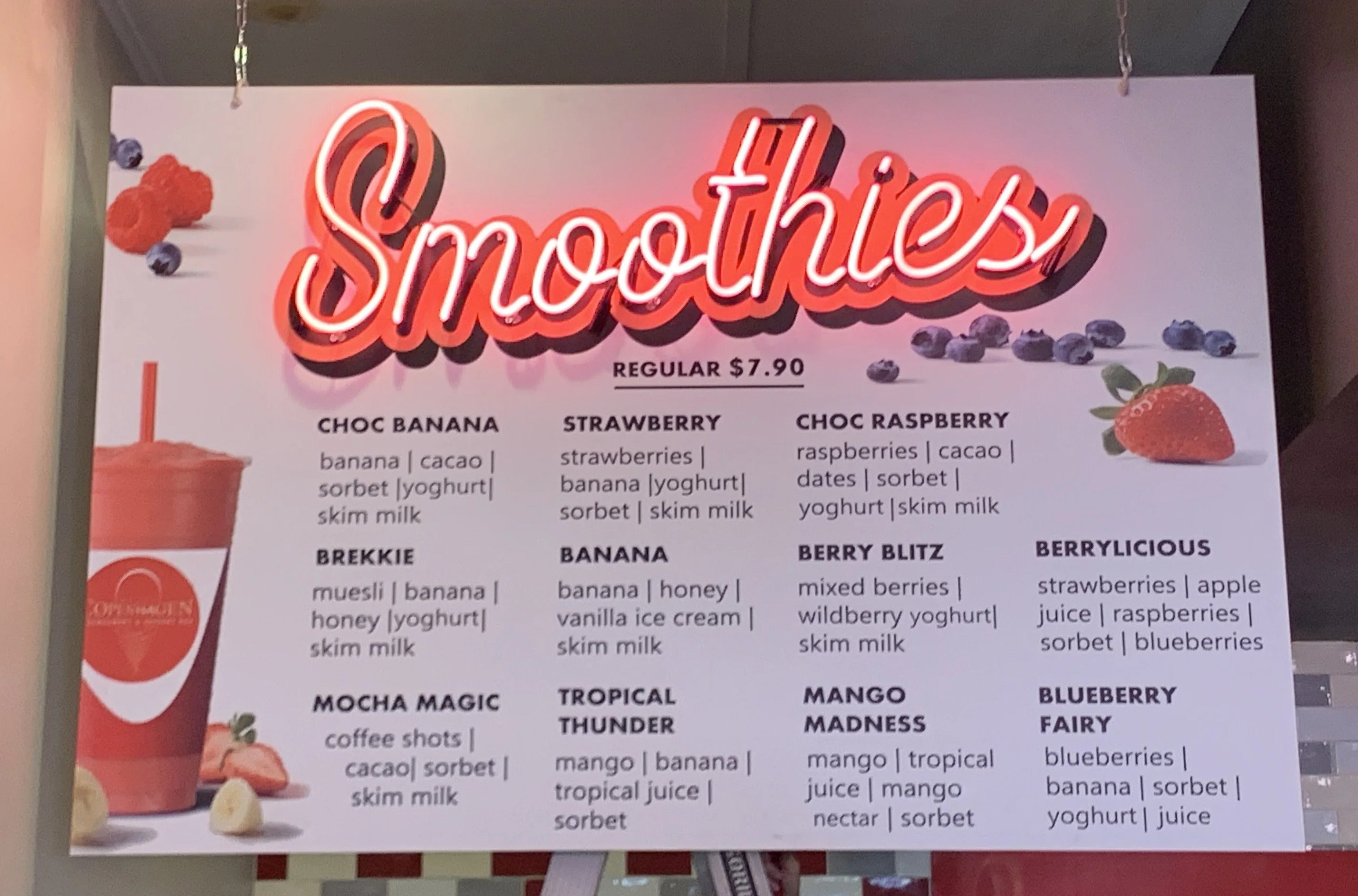LED Neon Flex Sign spelling out 'smoothies' in red neon above the smoothie menu in a cafe