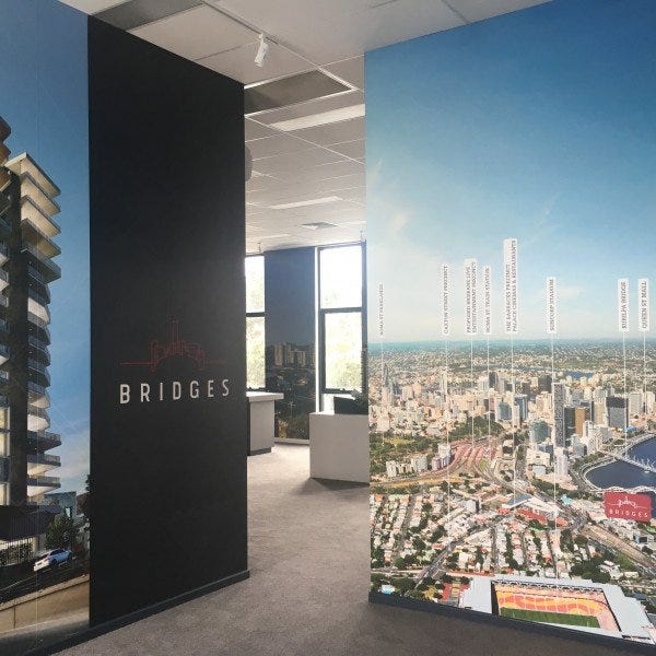 Wall Graphic office art on multiple walls with images of buildings and maps