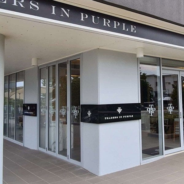 Traders in Purple Office Signage