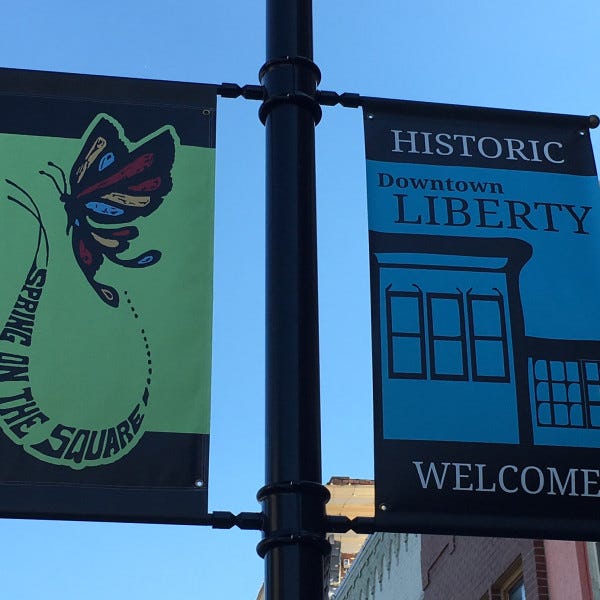 Spring pole banners