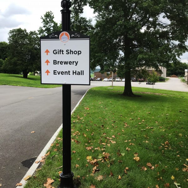 Sisters of St Benedict Outdoor wayfinding sign on a decorative post