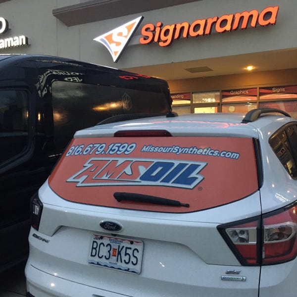 Signarama Liberty Sign With Trucks In Front