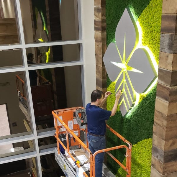 Halo Lit Logo On Moss Wall