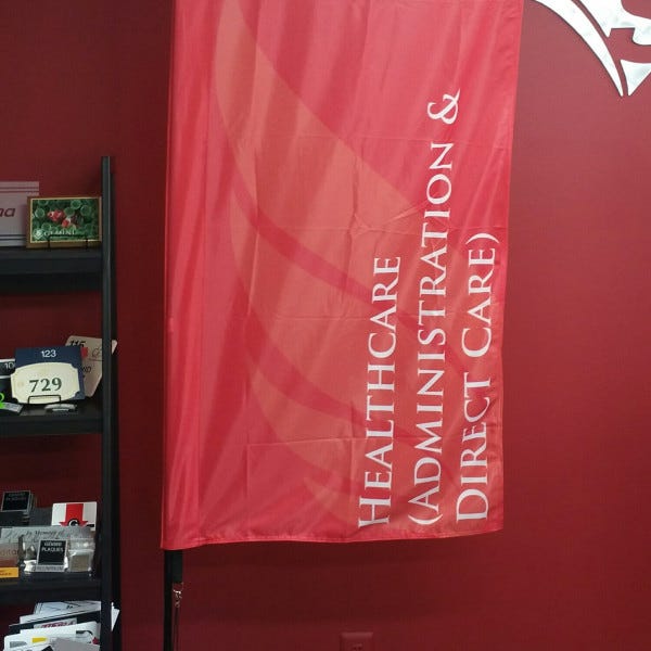 Flying Rectangular Flag With Crossbarsignarama Silver Springcommunity College Of Dc