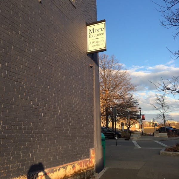 More Excuses Projecting Sign Installed