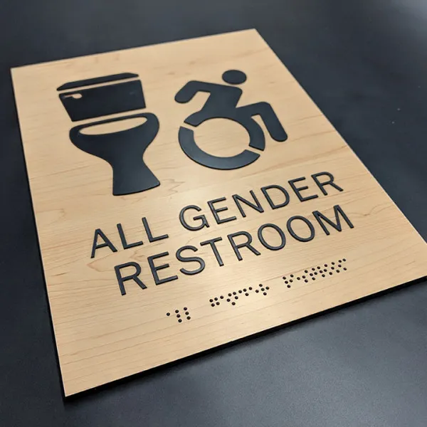 All Gender Restroom On Woodgrain Background South Burlington Vt
