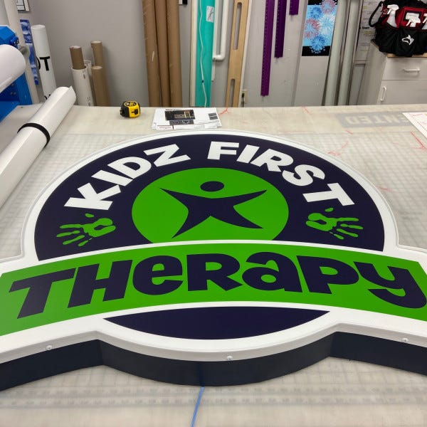 Kidz First Cabinet On Table Signarama Liberty Signs Near Me