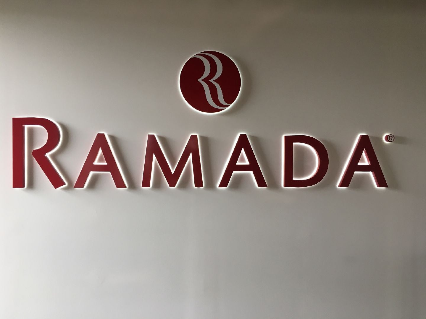 Red LED Backlit Sign with white halo lighting for a resort