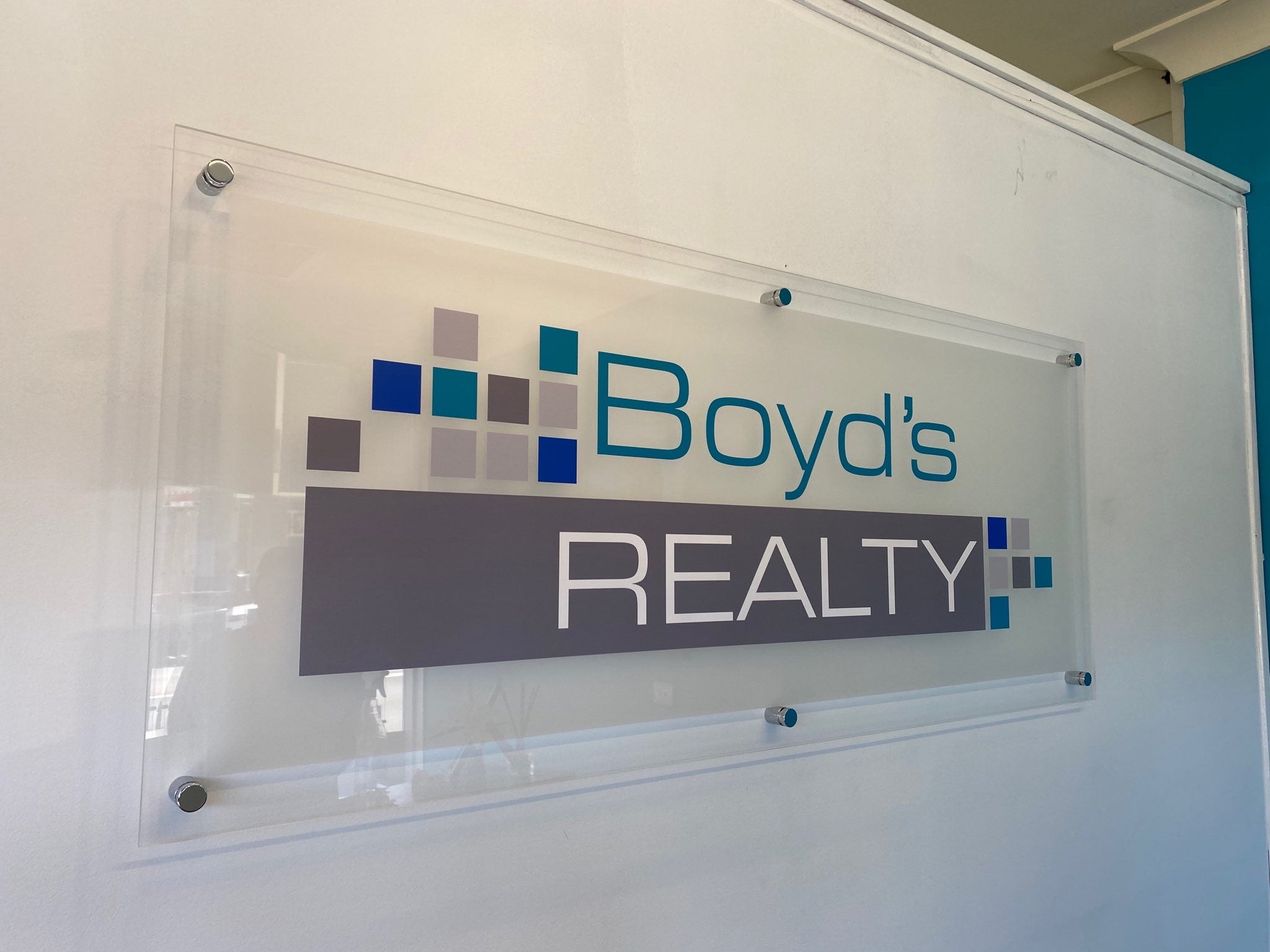 Boyd's Realty - acrylic reception sign with vinyl lettering finished with stainless steel stand offs - Signarama Sydney CBD South