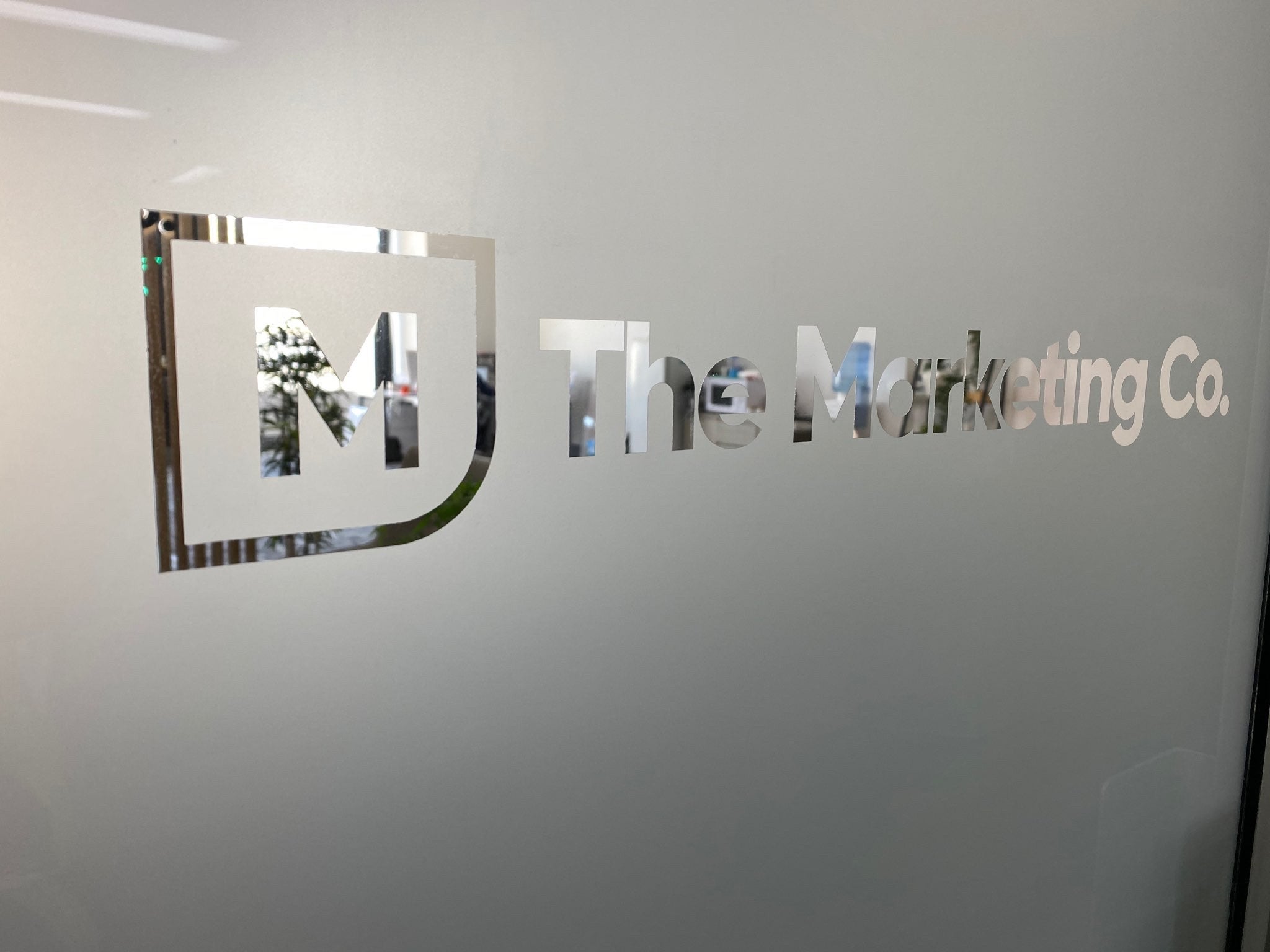 The Marketing Co Frost with reverse cut logo, door graphics - Signarama Sydney CBD South