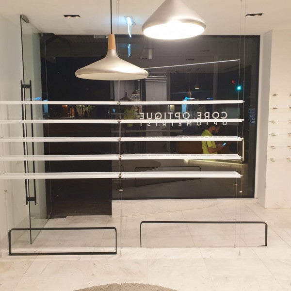 Core Optique Mosman_custom opal acrylic suspension shelf system