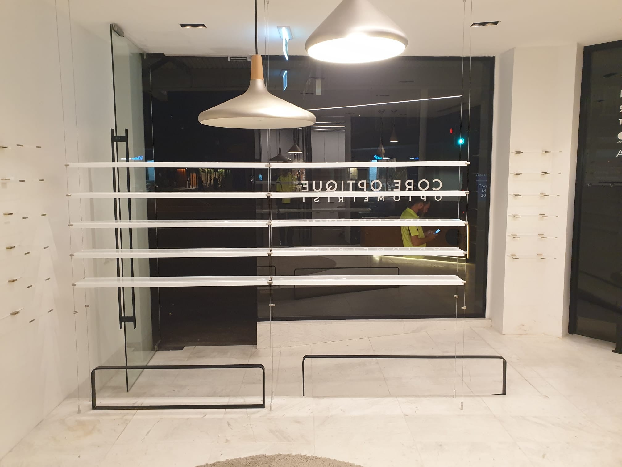 Core Optique Mosman_custom opal acrylic suspension shelf system